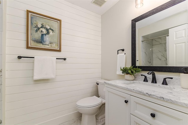 956 Harbor Town Dr, Venice, FL 34292 - full bathroom featuring marble finish floors, wood walls, vanity, toilet, and a marble finish shower