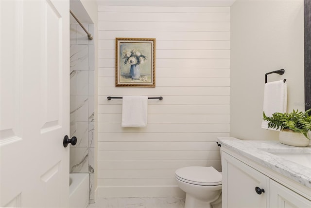 956 Harbor Town Dr, Venice, FL 34292 - full bathroom with marble finish flooring, vanity, toilet,  shower combination, and wooden walls