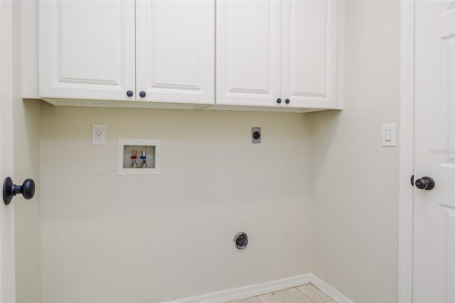 956 Harbor Town Dr, Venice, FL 34292 - washroom featuring electric dryer hookup, cabinet space, washer hookup, baseboards, and light tile patterned flooring