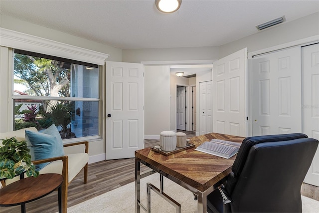 956 Harbor Town Dr, Venice, FL 34292 - office area featuring wood finished floors and baseboards