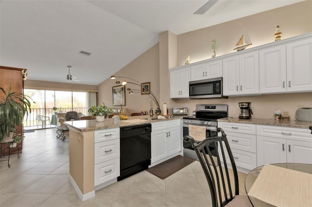 kitchen featuring lofted ceiling, kitchen peninsula, stainless steel appliances, light stone counters, and ceiling fan