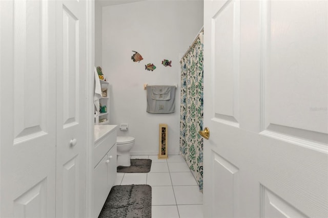 bathroom featuring vanity, toilet, and tile patterned floors