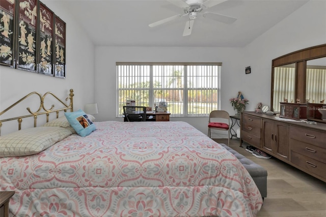 bedroom with ceiling fan and light hardwood / wood-style flooring