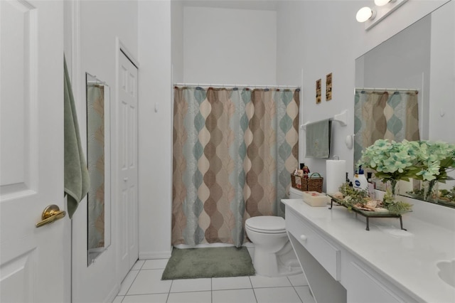 bathroom with vanity, toilet, tile patterned floors, and a shower with curtain