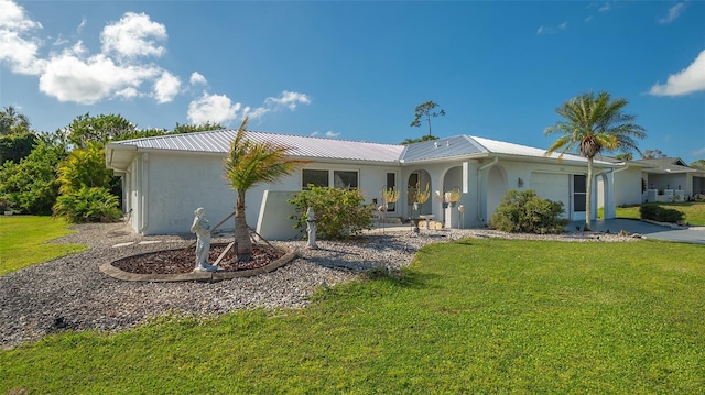 ranch-style home with a front lawn