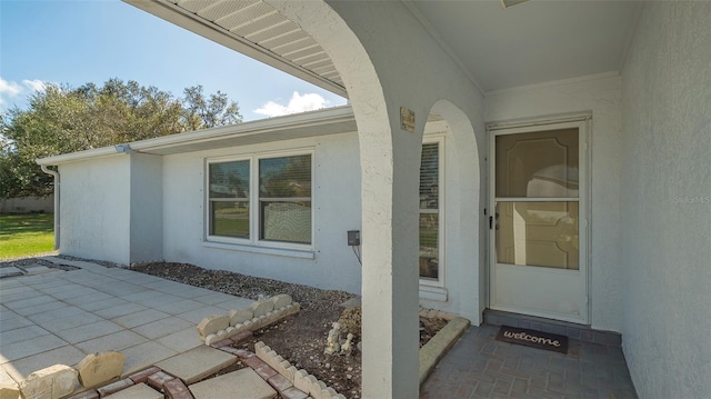 doorway to property featuring a patio