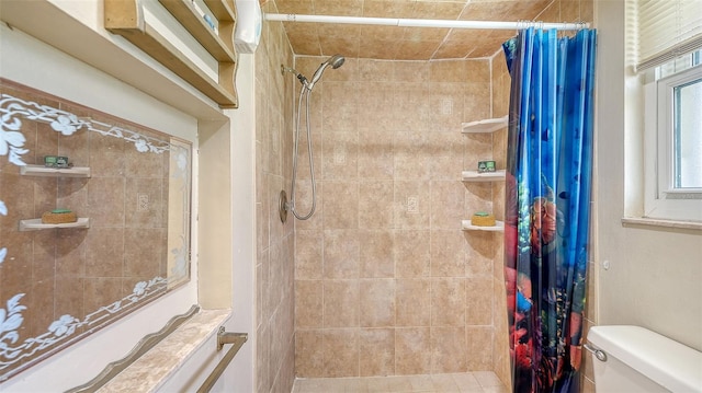 bathroom with a shower with shower curtain and toilet