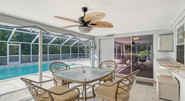 interior space with ceiling fan