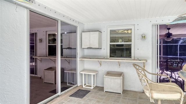 sunroom featuring wooden ceiling