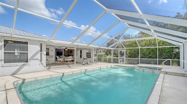 view of pool with a lanai and a patio area