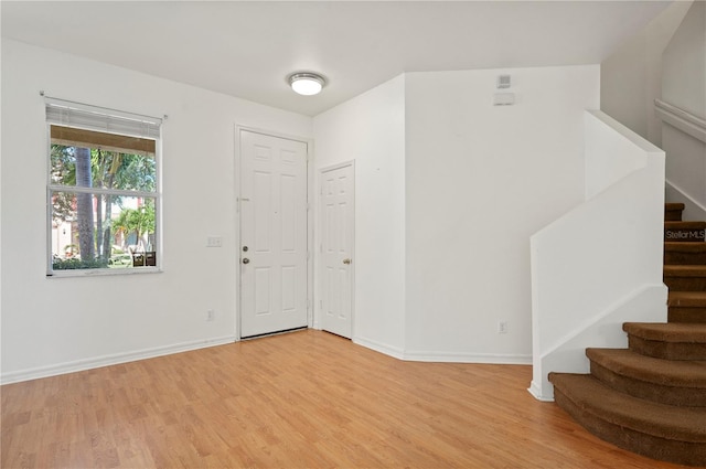 foyer entrance with light hardwood / wood-style flooring