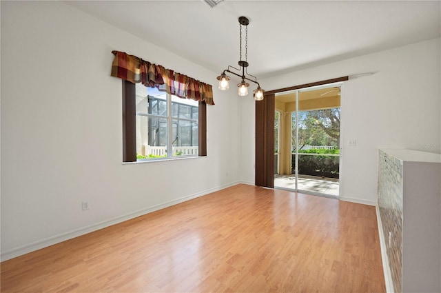 unfurnished dining area featuring light hardwood / wood-style flooring