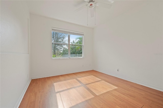 empty room featuring light hardwood / wood-style flooring and ceiling fan