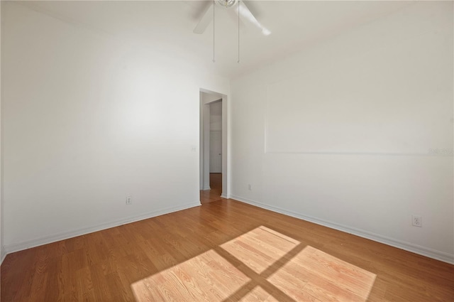 unfurnished room featuring hardwood / wood-style flooring and ceiling fan