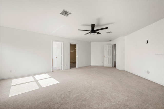 unfurnished room with light carpet and ceiling fan