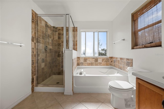 full bathroom with toilet, vanity, tile patterned floors, and independent shower and bath