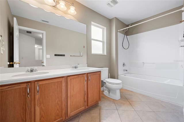 full bathroom with washtub / shower combination, vanity, tile patterned flooring, and toilet