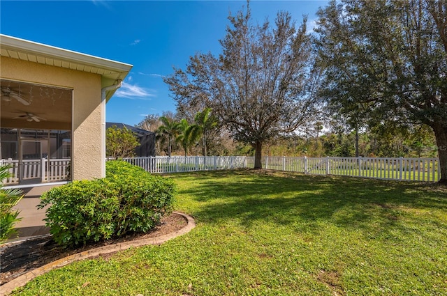 view of yard with ceiling fan