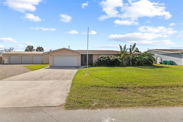 ranch-style home featuring a front lawn and a garage