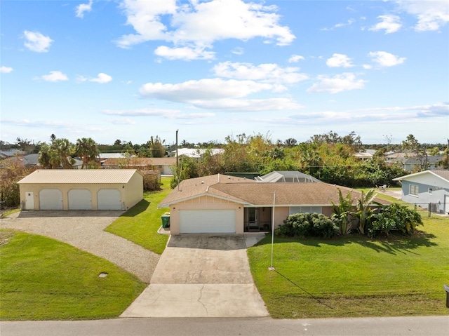 ranch-style home featuring a garage and a front lawn