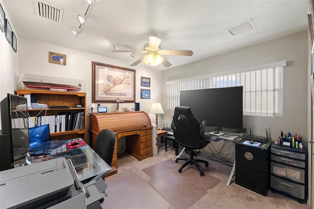 office with track lighting, light colored carpet, and ceiling fan