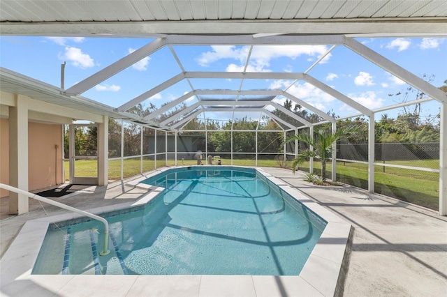 view of pool featuring a yard, a patio, and a lanai