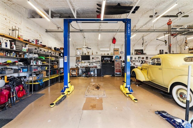 543 Lincoln Ave NW, Port Charlotte, FL 33952 - garage featuring a workshop area and a garage door opener