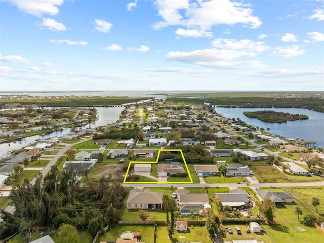 bird's eye view with a water view