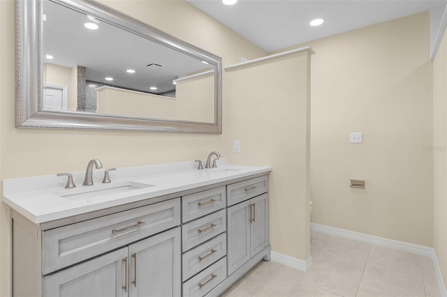 bathroom featuring tile patterned flooring and vanity