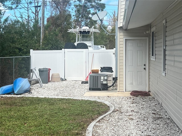 view of yard featuring central air condition unit