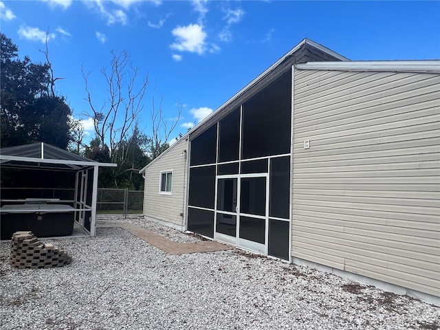 view of side of property featuring a jacuzzi