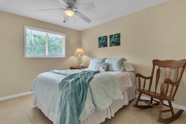 tiled bedroom with ceiling fan