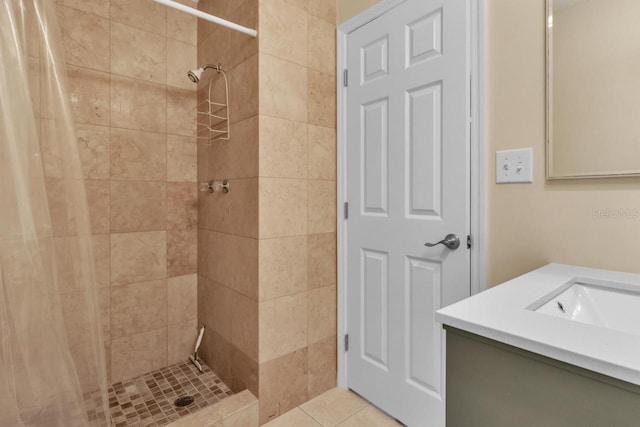 bathroom with tile patterned floors, vanity, and curtained shower