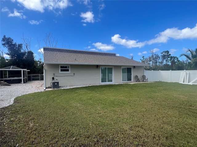 back of house with a patio area, a yard, and cooling unit