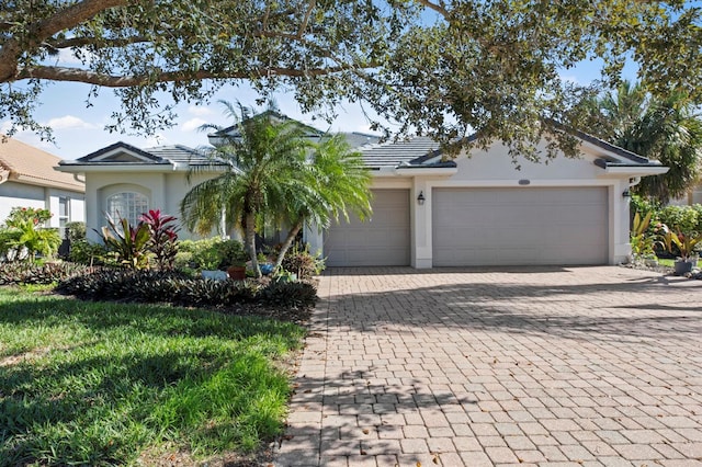 ranch-style house featuring a garage