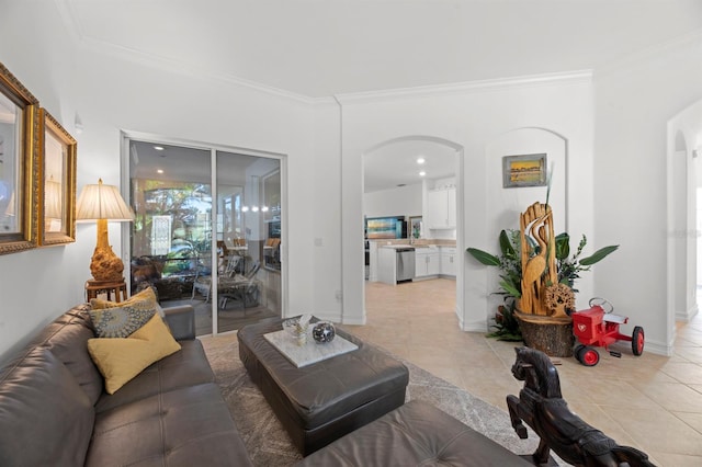 living room with ornamental molding and light tile patterned floors