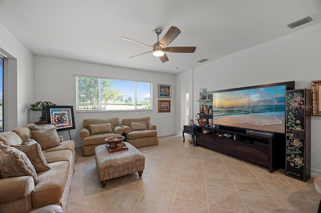 living room with light tile patterned floors and ceiling fan