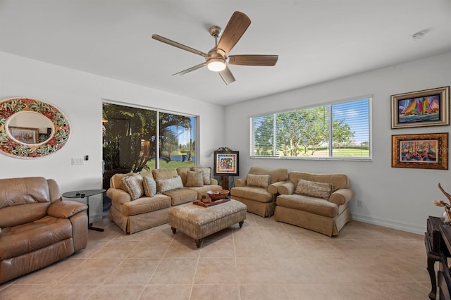 tiled living room with ceiling fan