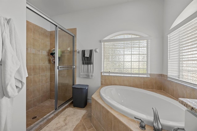 bathroom featuring separate shower and tub and tile patterned flooring