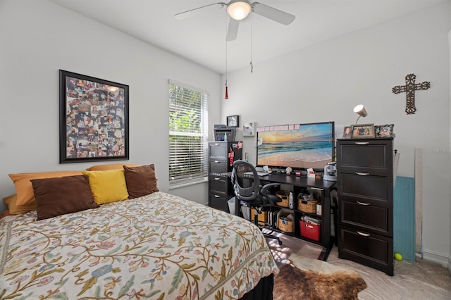 bedroom featuring light carpet and ceiling fan