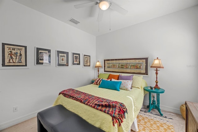 bedroom with ceiling fan and light carpet