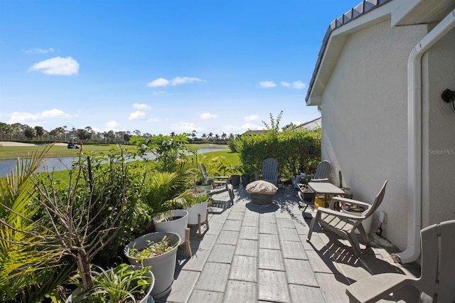 view of patio / terrace featuring a water view