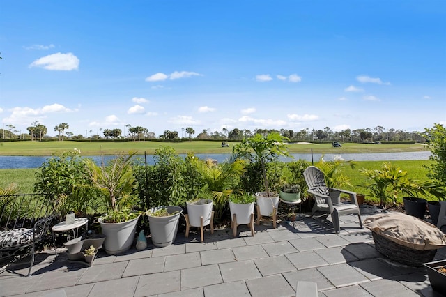 view of patio featuring a water view