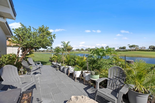 view of patio with a water view