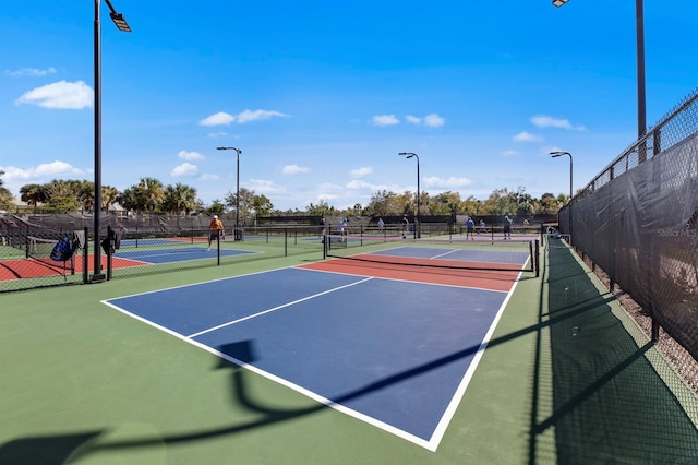 view of sport court with basketball hoop