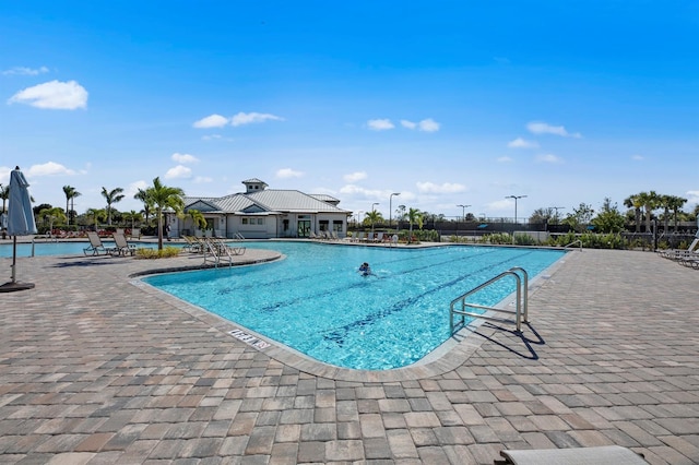 view of swimming pool with a patio