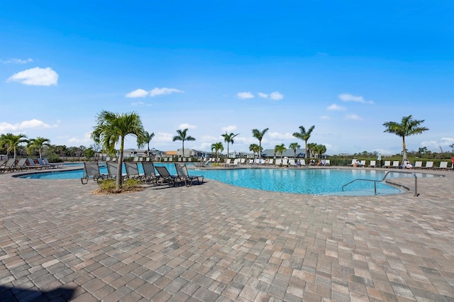 view of swimming pool with a patio