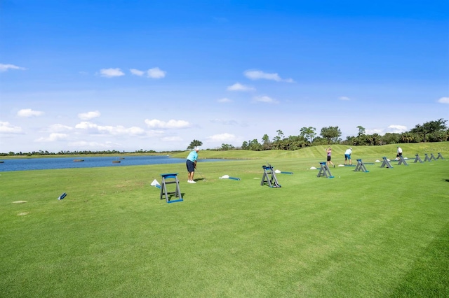 view of community featuring a yard and a water view