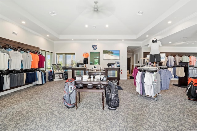 spacious closet with ceiling fan, carpet, and a tray ceiling