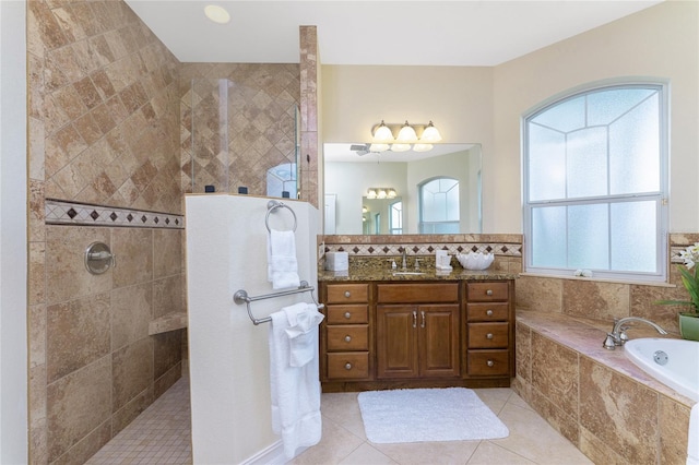 bathroom featuring vanity, tile patterned floors, and independent shower and bath